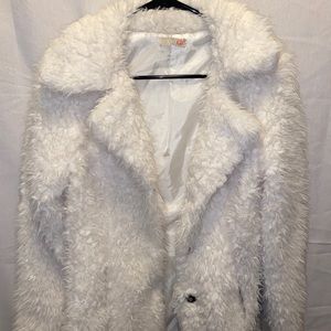 Woman’s light furry coat